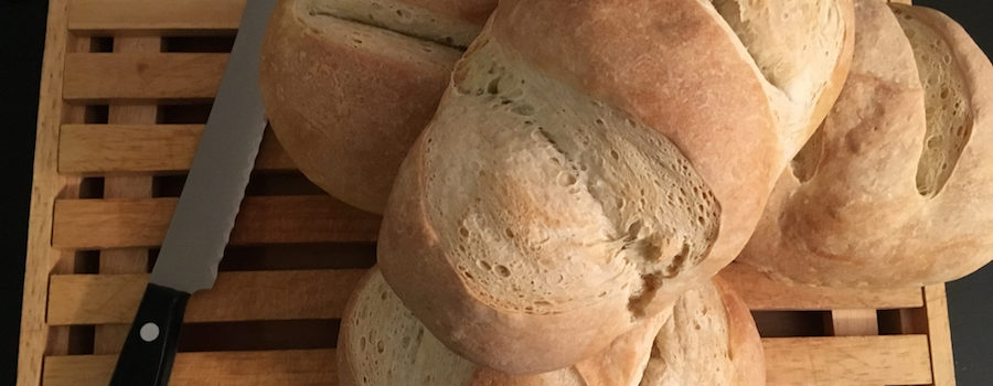 baked sourdough bread on bread board
