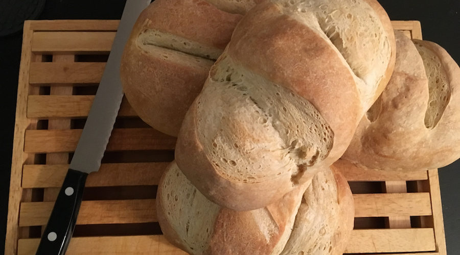 baked sourdough bread on bread board