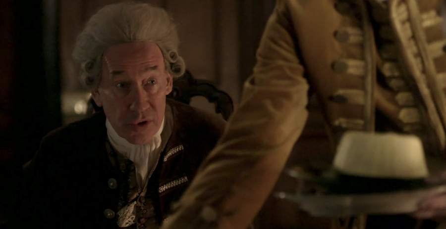 Simon Callow as the Duke of Sandringham close up with egg custard from Outlander STARZ Season 2