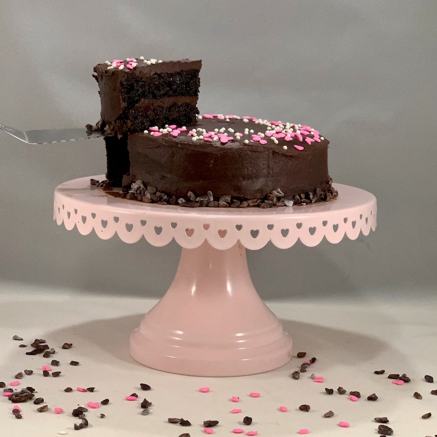 Tammy Lish Spencer, Port wine chocolate cake on cake stand with slice lifted