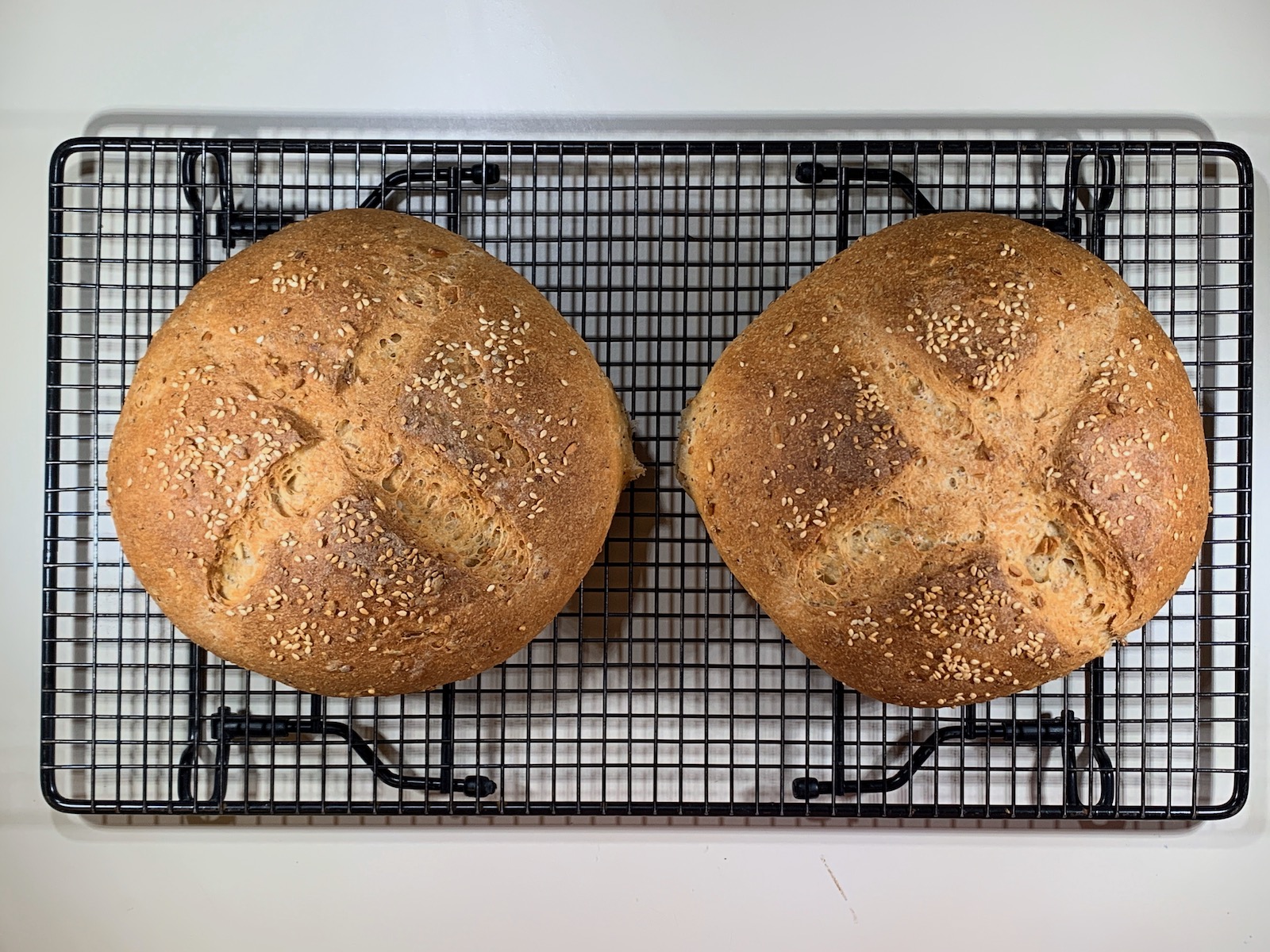 Multigrain Sourdough Bread cooling on rack