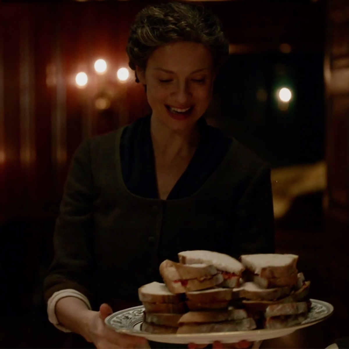 Claire bringing in tray of peanut butter & jelly sandwiches Outlander STARZ Season 5