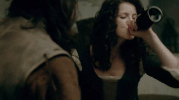 Gif of Claire chugging from a bottle of whisky