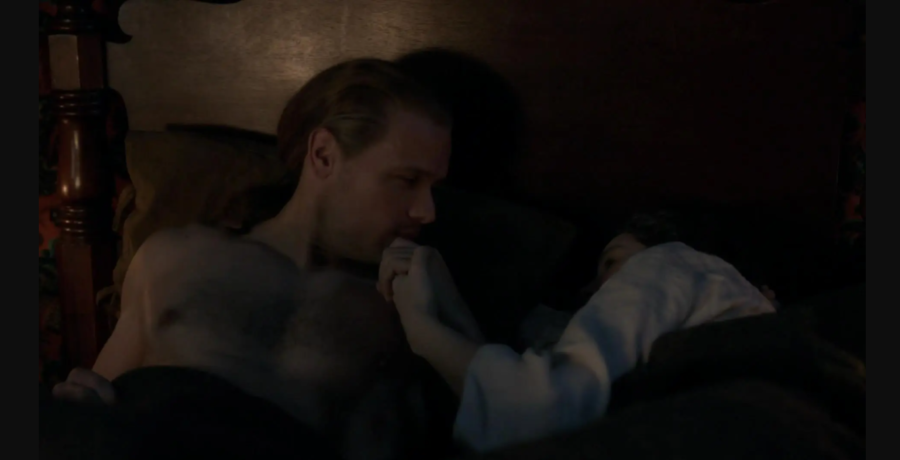 Jamie kisses Claire’s hand as they lie in bed
