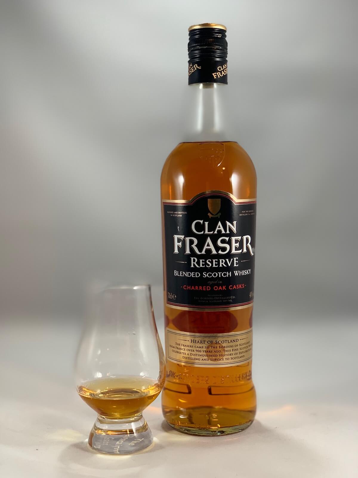 Clan Fraser Reserve scotch whisky in bottle and glass.